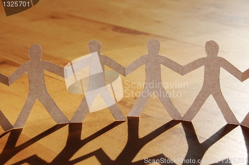 Image of teamwork of paper man