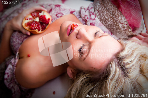 Image of blonde woman with closed eyes