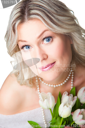 Image of blonde woman with bouquet of tulips