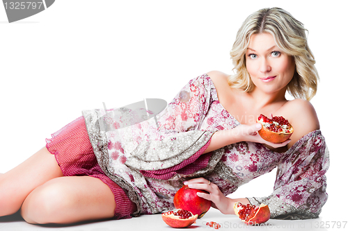 Image of blonde woman with pomegranate
