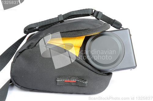 Image of Compact digital camera in bag