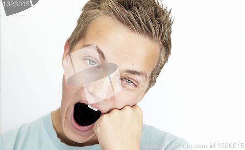 Image of yawning schoolboy