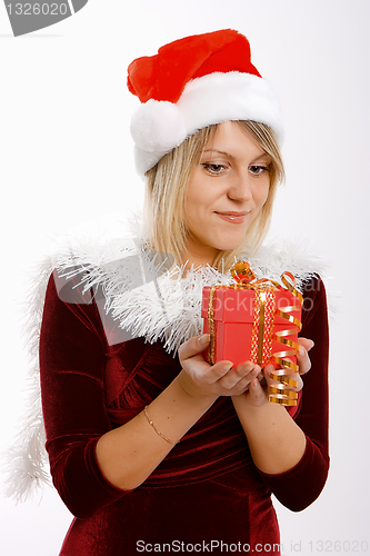 Image of girl in santa hat with a gift