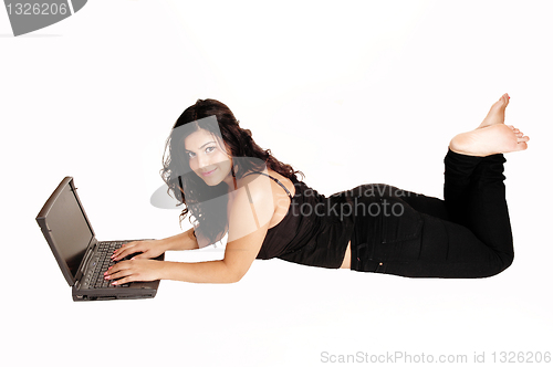 Image of Lying girl with laptop.