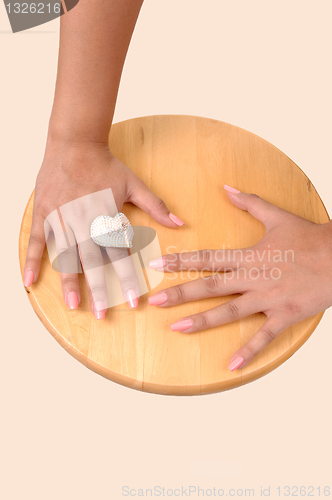 Image of The hands of a girl.