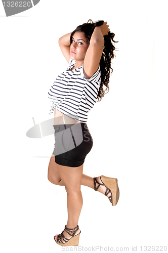 Image of Girl standing in shorts.