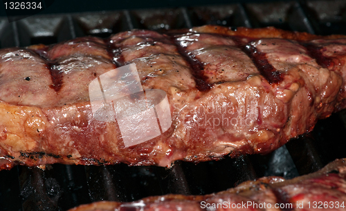 Image of Steak in barbecue grill