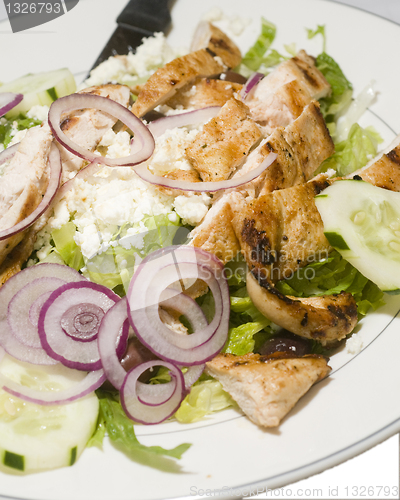 Image of Greek salad feta cheese  grilled chicken fillet pieces