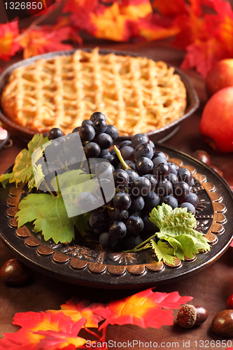 Image of Red grapes and apple pie