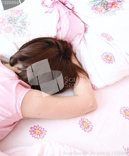 Image of Young woman sleeping.