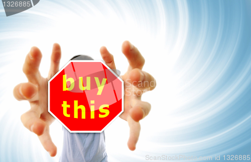 Image of Man grabing a red sign.