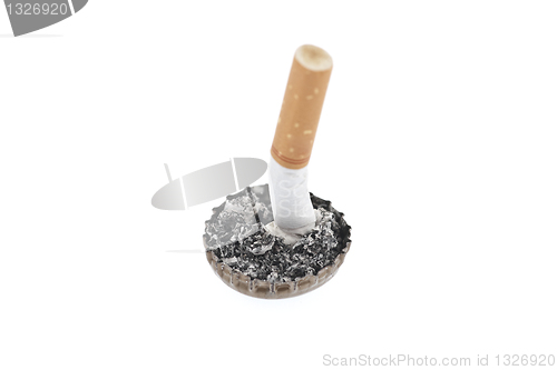 Image of Cigarette butt and ash in a bottle cap