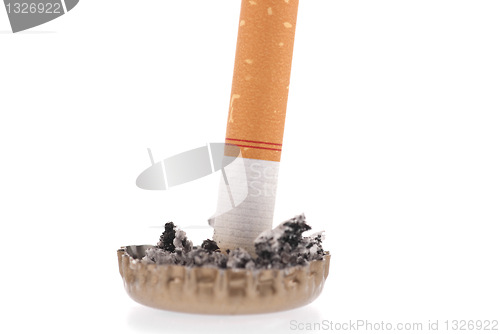 Image of Cigarette butt and ash in a bottle cap