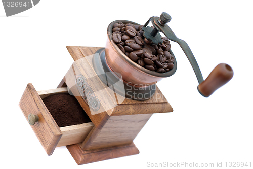 Image of Coffee grinder and coffee beans