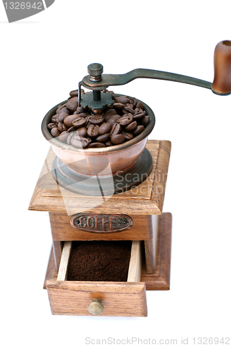 Image of Coffee grinder and coffee beans