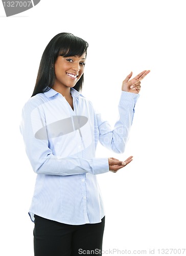 Image of Smiling young woman pointing