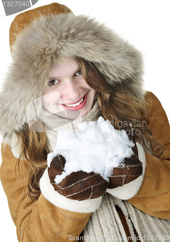 Image of Playful winter girl holding snow