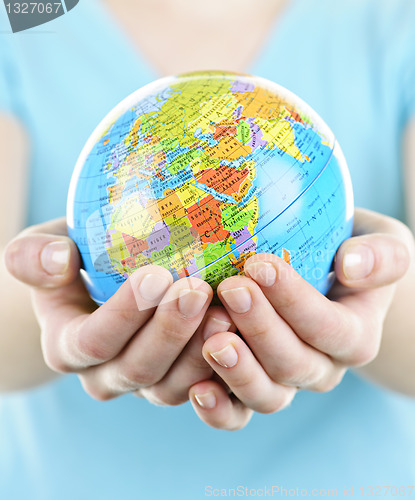 Image of Hands holding globe