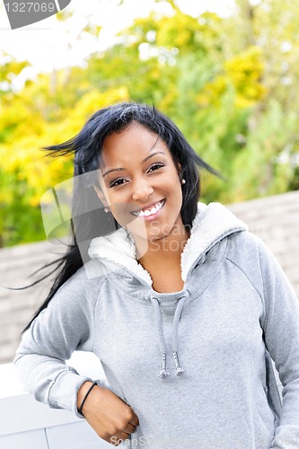 Image of Portrait of young woman outdoors