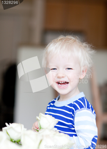 Image of toddler with flower