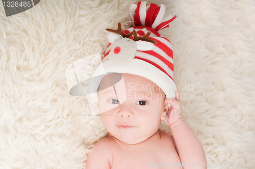 Image of Newborn baby in chritstmas hat