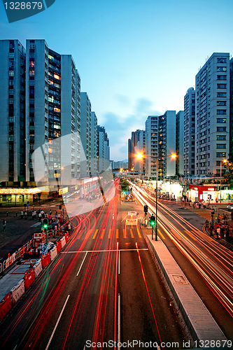 Image of traffic in downtown at sunset moment