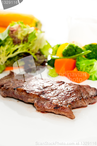 Image of juicy BBQ grilled rib eye ,ribeye steak and vegetables