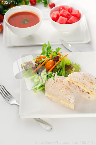 Image of tuna and cheese sandwich with salad