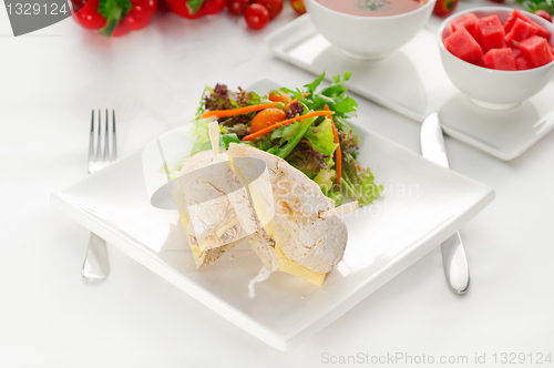 Image of tuna and cheese sandwich with salad