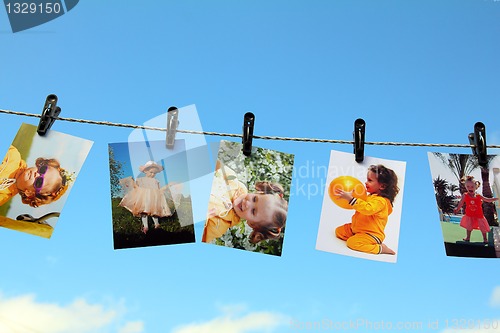 Image of photos are hanging against blue sky