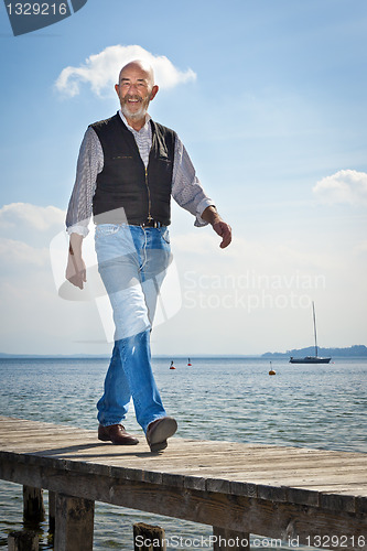 Image of old man walking