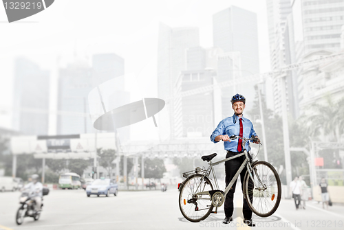Image of businessman with bicycle