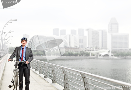 Image of businessman with bicycle