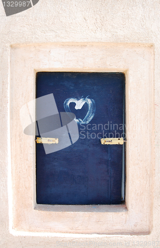 Image of Old window with a heart