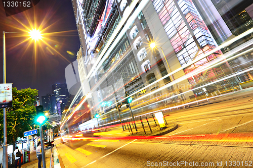 Image of modern urban city at night with traffic