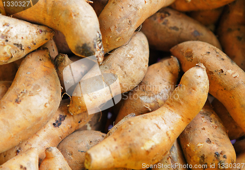 Image of Organic sweet potatoes at market