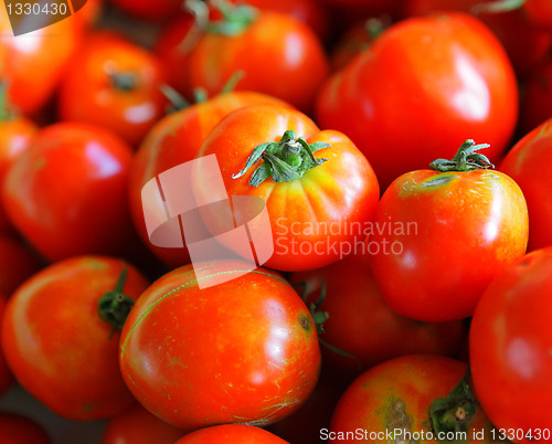Image of tomatoes arranged at market