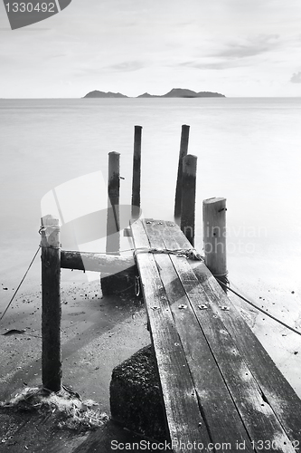 Image of pier go into sea , black and white