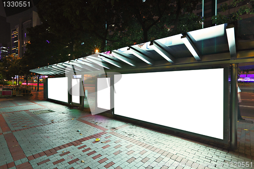 Image of Blank billboard on bus stop at night 