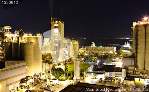 Image of cement factory at night