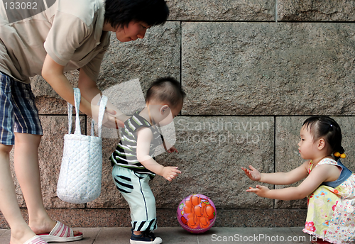 Image of Family playing with a ball