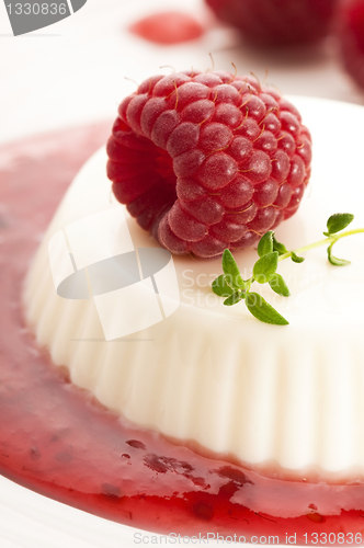 Image of Vanilla panna cotta with berry sauce