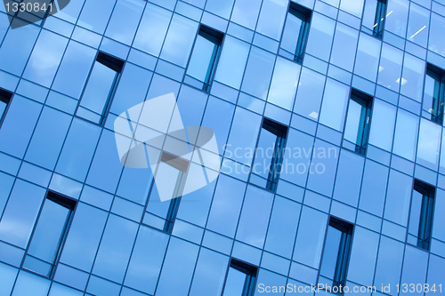 Image of blue glass wall office building