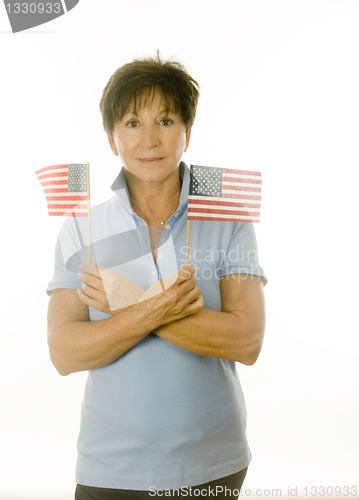 Image of female middle age senior patriotic American with flags