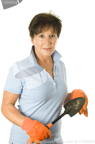 Image of female middle age senior woman gardener hand tool hoe trowel spa
