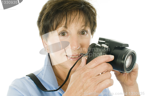 Image of female middle age senior  lady compact digital camera