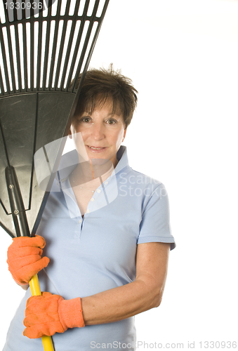 Image of female middle age senior female woman gardener leaf rake