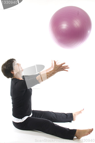 Image of woman using core training fitness ball exercising