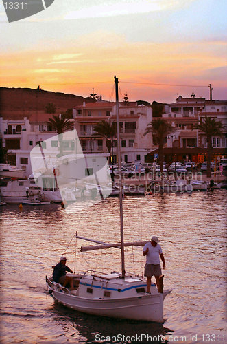 Image of fisherman coming home