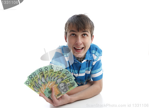 Image of Boy with a fan of money banknotes